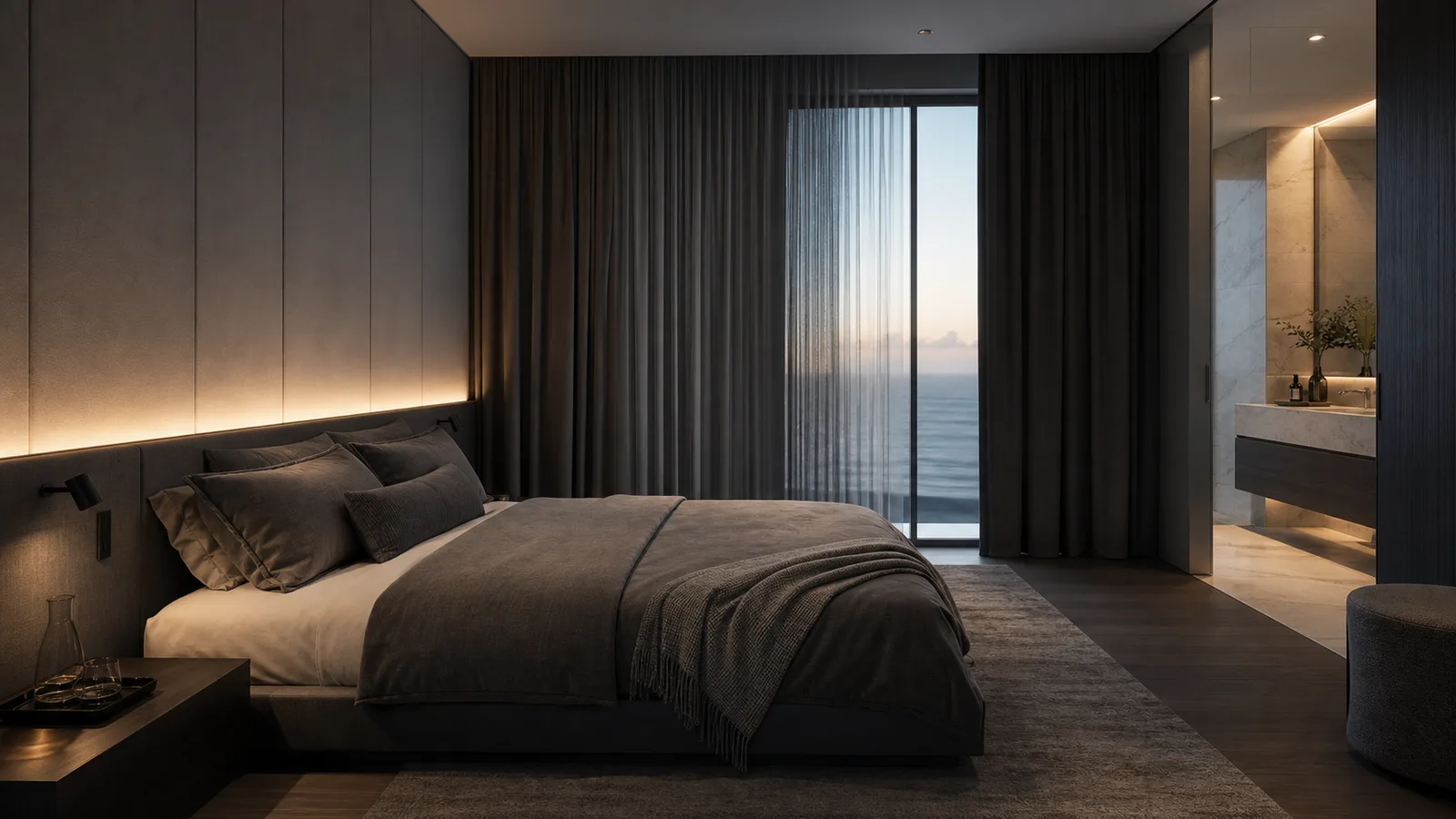 Directional mood image of a calm bedroom facing the ocean at dusk